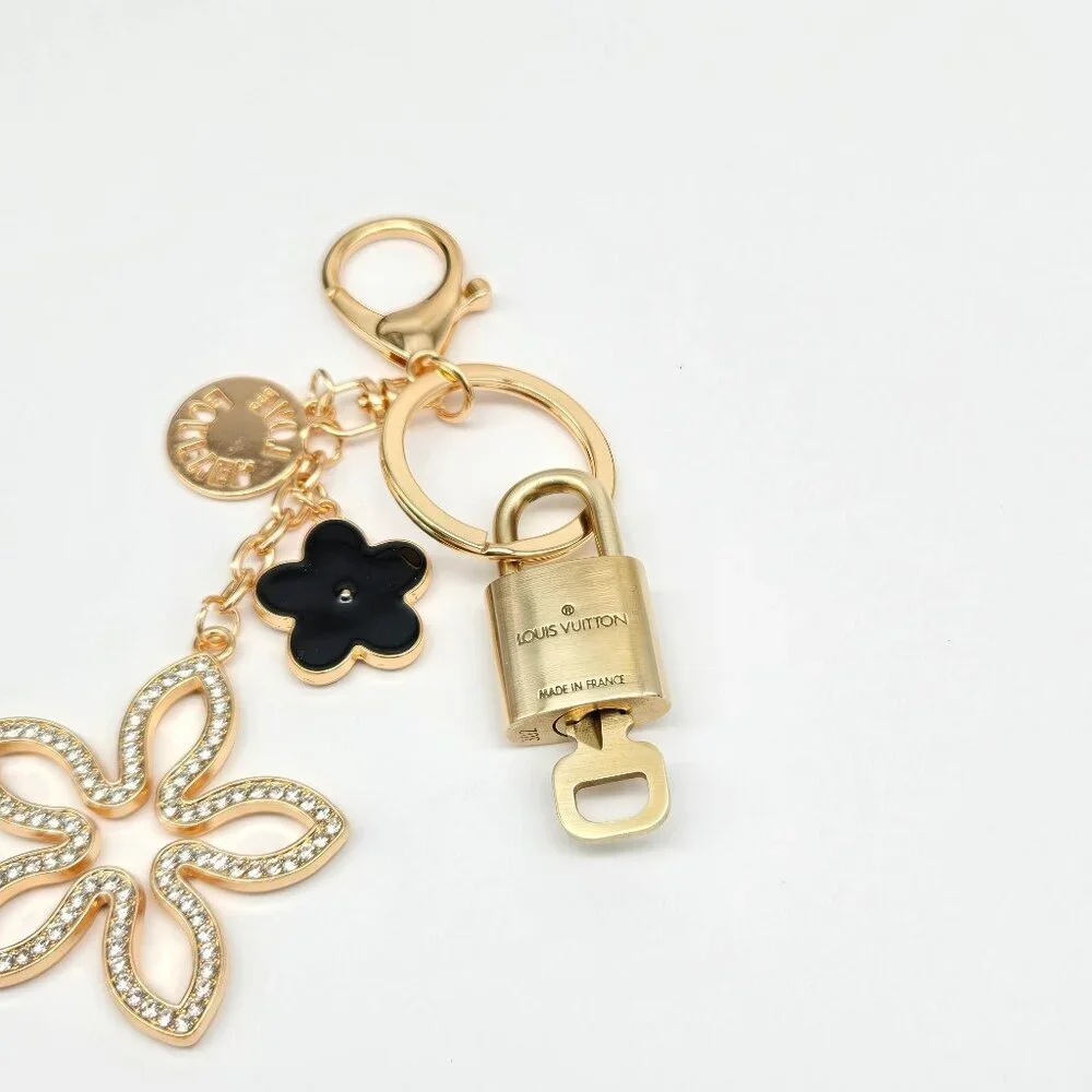 Louis Vuitton Gold-Tone Crystal Flower Keychain with Black Accent